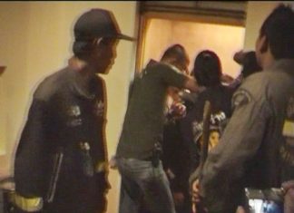 Rescue workers prize open the elevator doors to allow the trapped students to escape.